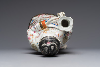 A Chinese famille rose candle holder in the shape of a court lady holding a 'Gu' vase, Qianlong