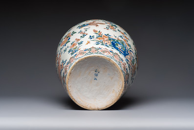 A large Dutch Delft cashmere palette vase with a phoenix and birds among flowers, ca. 1700
