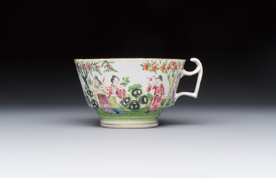 A Chinese Canton famille rose cup and saucer with figures in a garden, 19th C.