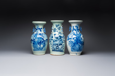 Two Chinese blue and white celadon-ground vases and a blue and white vase, on wooden stands, 19th C.