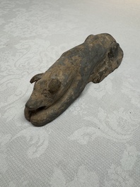 A Chinese grey pottery model of a reclining dog, Han