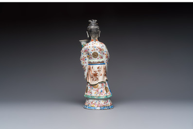 A Chinese famille rose candle holder in the shape of a court lady holding a 'Gu' vase, Qianlong