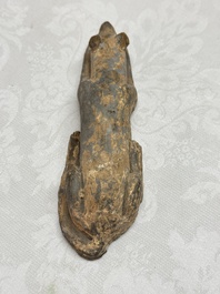 A Chinese grey pottery model of a reclining dog, Han