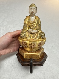 A Japanese Satsuma figure of Buddha seated on a lotus base, Hododa 保土田 mark, Meiji, 19/20th C.