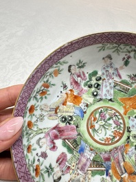 A Chinese Canton famille rose cup and saucer with figures in a garden, 19th C.