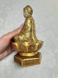 A Japanese Satsuma figure of Buddha seated on a lotus base, Hododa 保土田 mark, Meiji, 19/20th C.