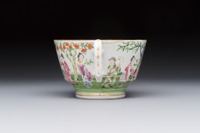 A Chinese Canton famille rose cup and saucer with figures in a garden, 19th C.
