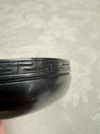 A Chinese blue and white ovoid 'Antiquities' jar with a wooden cover, Kangxi