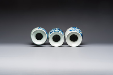 Two Chinese blue and white celadon-ground vases and a blue and white vase, on wooden stands, 19th C.