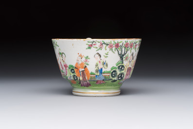 A Chinese Canton famille rose cup and saucer with figures in a garden, 19th C.