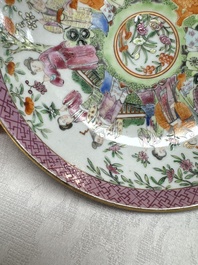 A Chinese Canton famille rose cup and saucer with figures in a garden, 19th C.