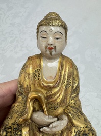 A Japanese Satsuma figure of Buddha seated on a lotus base, Hododa 保土田 mark, Meiji, 19/20th C.