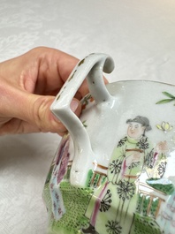 A Chinese Canton famille rose cup and saucer with figures in a garden, 19th C.