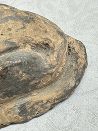 A Chinese grey pottery model of a reclining dog, Han