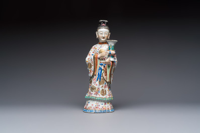A Chinese famille rose candle holder in the shape of a court lady holding a 'Gu' vase, Qianlong