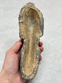A Chinese grey pottery model of a reclining dog, Han