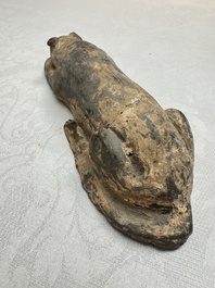 A Chinese grey pottery model of a reclining dog, Han