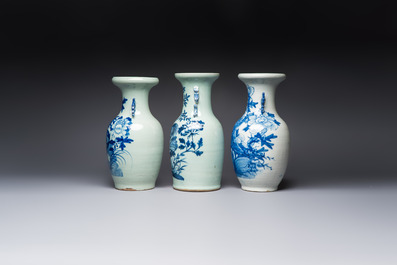 Two Chinese blue and white celadon-ground vases and a blue and white vase, on wooden stands, 19th C.