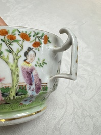A Chinese Canton famille rose cup and saucer with figures in a garden, 19th C.
