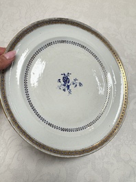 Two Chinese export famille rose plates and three gilt blue-enamelled plates, Qianlong/Jiajing