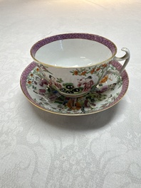 A Chinese Canton famille rose cup and saucer with figures in a garden, 19th C.
