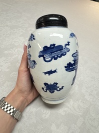A Chinese blue and white ovoid 'Antiquities' jar with a wooden cover, Kangxi
