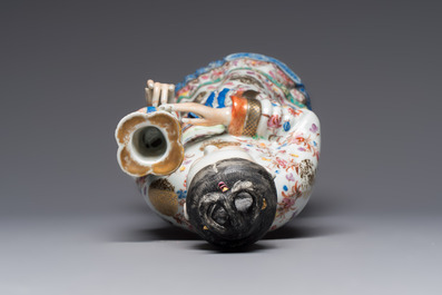 A Chinese famille rose candle holder in the shape of a court lady holding a 'Gu' vase, Qianlong