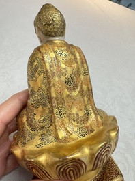 A Japanese Satsuma figure of Buddha seated on a lotus base, Hododa 保土田 mark, Meiji, 19/20th C.