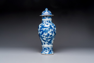 A Chinese blue and white covered vase with figures in landscapes, Kangxi