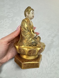 A Japanese Satsuma figure of Buddha seated on a lotus base, Hododa 保土田 mark, Meiji, 19/20th C.