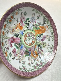 A Chinese Canton famille rose cup and saucer with figures in a garden, 19th C.