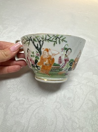 A Chinese Canton famille rose cup and saucer with figures in a garden, 19th C.