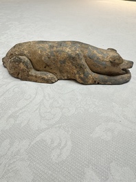 A Chinese grey pottery model of a reclining dog, Han