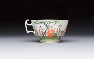 A Chinese Canton famille rose cup and saucer with figures in a garden, 19th C.