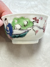 A fine Chinese famille rose cup and saucer with a couple on a terrace, Yongzheng/Qianlong