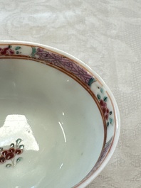 A fine Chinese famille rose cup and saucer with a couple on a terrace, Yongzheng/Qianlong