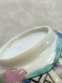 A fine Chinese famille rose cup and saucer with a couple on a terrace, Yongzheng/Qianlong