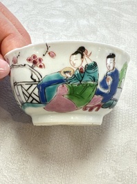 A fine Chinese famille rose cup and saucer with a couple on a terrace, Yongzheng/Qianlong