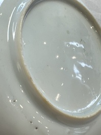 A fine Chinese famille rose cup and saucer with a couple on a terrace, Yongzheng/Qianlong