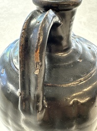 A Chinese Yaozhou black-glazed ewer with a ribbed body, Song