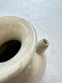 A Chinese cream-glazed ewer with a barrel-shaped body, Hebei/Henan provinces, Tang/Five Dynasties