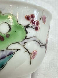 A fine Chinese famille rose cup and saucer with a couple on a terrace, Yongzheng/Qianlong
