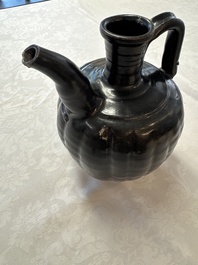A Chinese Yaozhou black-glazed ewer with a ribbed body, Song