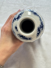 A pair of Chinese blue and white 'Buddhist Lions' triple gourd vases on reticulated wooden stands, 19th C.