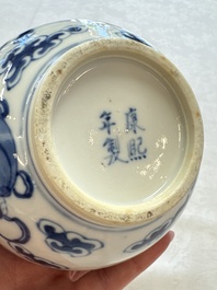 A pair of Chinese blue and white 'Buddhist Lions' triple gourd vases on reticulated wooden stands, 19th C.