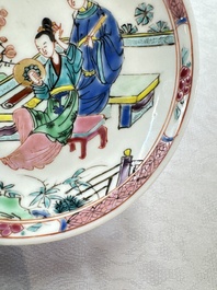 A fine Chinese famille rose cup and saucer with a couple on a terrace, Yongzheng/Qianlong