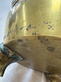 A large Chinese bronze 'Dragon' tripod censer, 19th C.