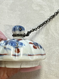 A Chinese blue and white tea caddy, a teapot and an Imari-style teapot, Kangxi/Yongzheng