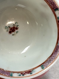 A fine Chinese famille rose cup and saucer with a couple on a terrace, Yongzheng/Qianlong