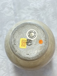 A Chinese cream-glazed ewer with a barrel-shaped body, Hebei/Henan provinces, Tang/Five Dynasties